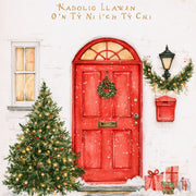 Nadolig Llawen o’n Tŷ Ni i’ch Tŷ Chi — Drws coch / Welsh card featuring a red door, wreath and Christmas tree